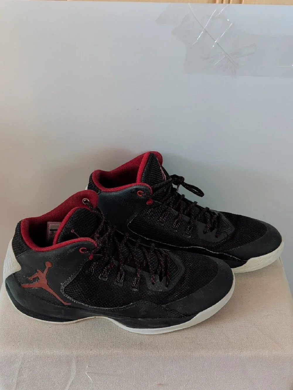 Jordan Men’s Black and Red High-Top Athletic Basketball Shoes.